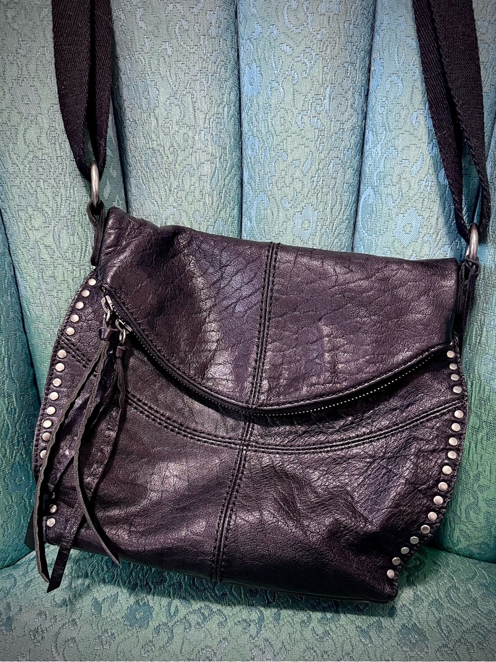 The Sak Black Leather Studded Crossbody with Fringe Zip Pull